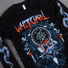 Load image into Gallery viewer, close up image of a black long sleeve tee shirt laid on a concrete. tee has full body print of an altar with an angel laying across, above a serpent head. at the top says whitechapel. each sleeve has a print of a serpentine wrapped around an arrow
