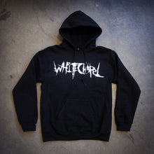 Load image into Gallery viewer, image of a black pullover hoodie laid flat on a concrete floor. hoodie has center chest print in white that says whitechapel
