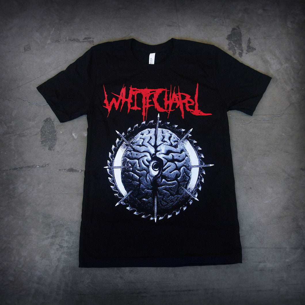 image of a black tee shirt laid flat on a concrete floor. front of tee has full body print of a black and white image of a brain. at the top, in red says whitechapel