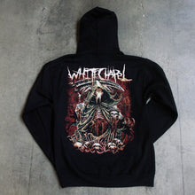 Load image into Gallery viewer, Image of the back of a black hooded sweatshirt against a grey concrete background. the back features a red, white, black, and bluish gray graphic of a an animal skull with a third eye holding a scythe and wearing a cloak. Its ribs are showing. There are skull heads all around the monster. There is a red background behind the graphic.

