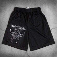 Load image into Gallery viewer, Image of black athletic shorts against a grey concrete background. The right bottom of the leg of the shorts says &quot;whitechapel&quot; across the leg in white text. Below that is a graphic of three cresent moons outlined in white- one facing the left, one the right, and one straight down. In the center of that is a double pentagram- two stars mirroring and slightly overlapping each other, also in white. 
