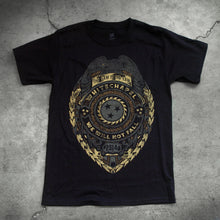 Load image into Gallery viewer, Image of a black tshirt against a concrete background. The shirt is a graphic of a badge. There is a bird at the top, and below that it says the saw is the law. the center of the badge has a circle with a sawblade with three stars on the inside of the saw blade. Wrapped around the circle reads &quot;whitechapel, we will not fall&quot;. Below this it says 2014. The graphic is a faded grey/gold and black color.

