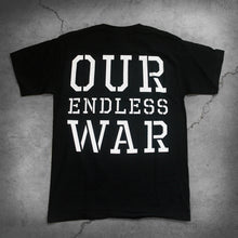 Load image into Gallery viewer, image of the back of a black tee shirt on a white background. the back of the shirt in large white text reads &quot;our endless war&quot;.
