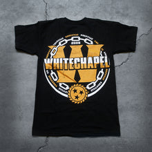 Load image into Gallery viewer, Image of the back of a black tshirt against a grey concrete background. There is a large yellow W in the center of the shirt, and the word &quot;whitechapel&quot; is written across it in a white to yellow gradient. surrounding this is a white chain, and the words knoxville repeatedly in alternating yellow and white colors. There is a yellow sawblade with three black stars in the center of the sawblade just under the large W.
