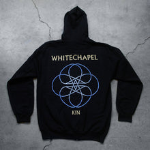 Load image into Gallery viewer, Image of the back of a black zip up sweatshirt against a grey concrete background. Across the shoulder area in white text reads &quot;whitechapel&quot;. Below this is a circular lined abstract design with two stars in the center, designed to look like a double pentagram. This is white and blue. Below this design in white text reads &quot;Kin&quot;.
