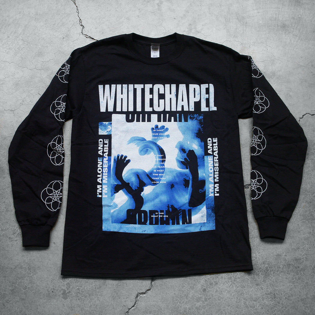  Image of a black long sleeve against a grey concrete background. Across the chest in white distressed text reads 