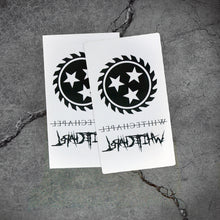 Load image into Gallery viewer, Image of two white pieces of paper with temporary tattoos on them against a grey concrete background. There is a black sawblade with three white stars in the center of it. There is the word whitechapel in black text with a thin black line through it, and the word whitechapel in black heavy metal style font. Both sheets are identical.
