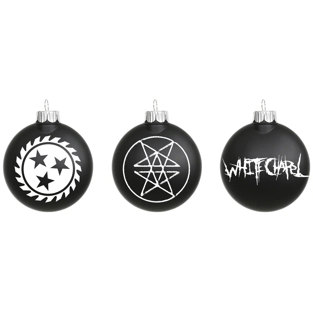 image of three black christmas bulb ornaments on a white background. the left one has a white sawblade, the middle one has two stars, and the one on the white says whitechapel