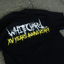 Load image into Gallery viewer, Image of the back of a black tshirt against a grey concrete background. The back of the shirt across the shoulder in white heavy metal style font says whitechapel. below that in the same font, in yellow, reads &quot;xv years anniversary&quot;.
