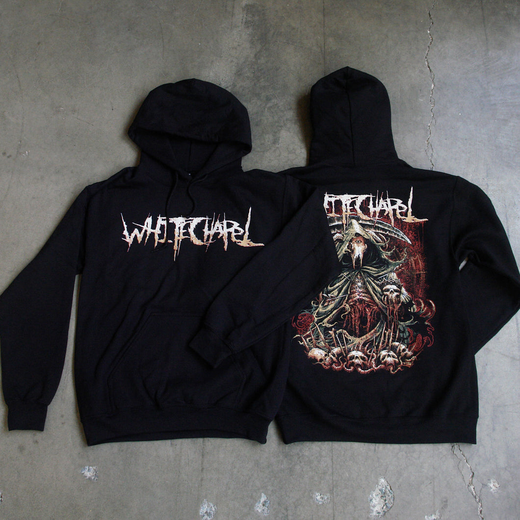 Image of the front and back of a black hooded sweatshirt against a grey concrete background. Across the chest in white to light orange gradient in heavy metal font reads whitechapel. the back features a red, white, black, and bluish gray graphic of a an animal skull with a third eye holding a scythe and wearing a cloak. Its ribs are showing. There are skull heads all around the monster. There is a red background behind the graphic.